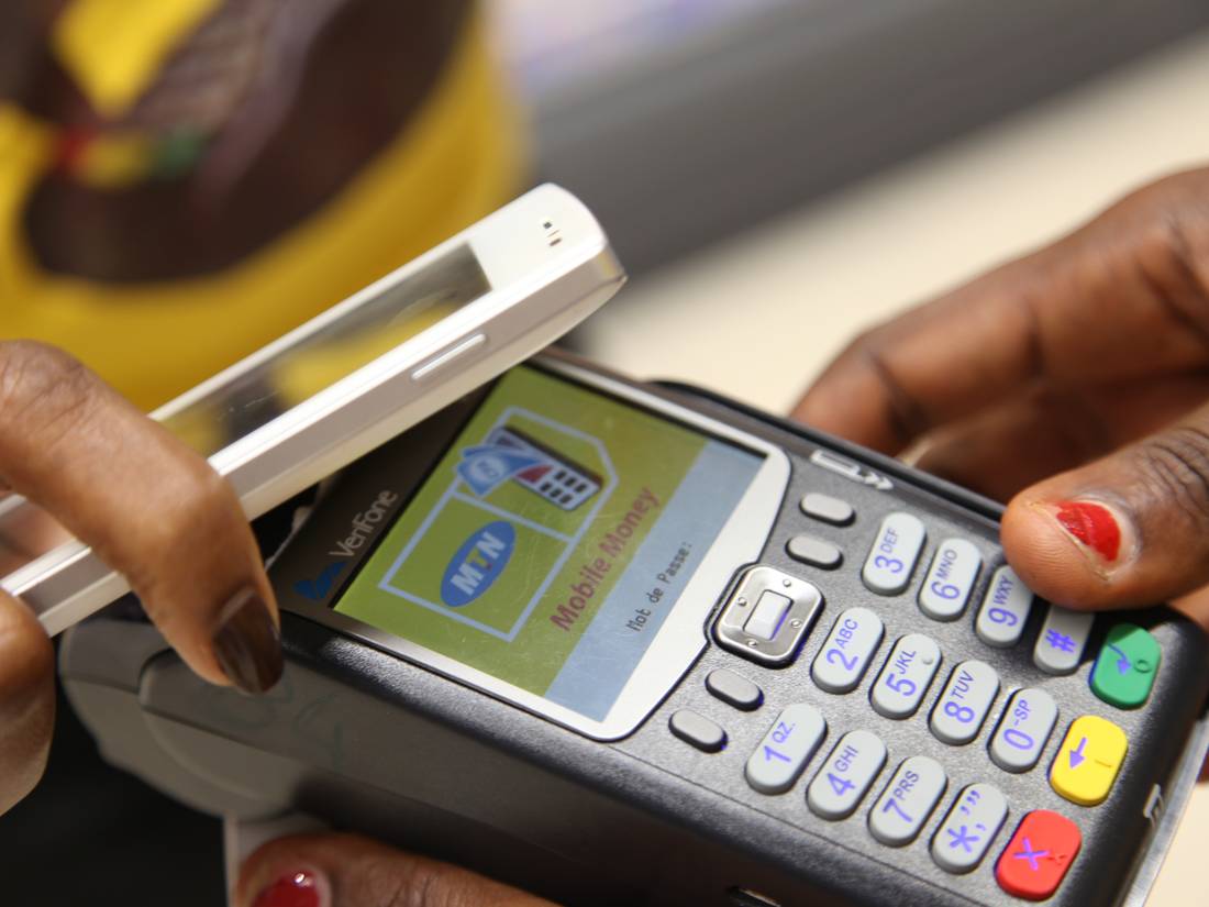 Paying by phone at an MTN Mobile Money terminal in Abidjan